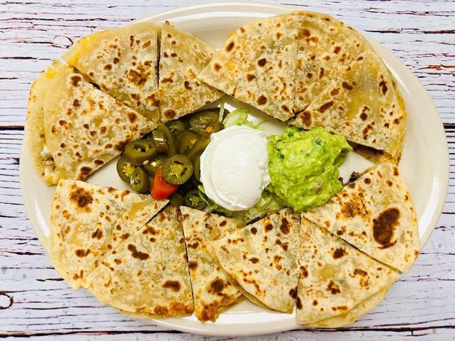 Large Vegetable Quesadillas · Sautéed Onions, Mushrooms, Red And Green Bell Peppers. Served With Jalapeños, Sour Cream And Guacamole