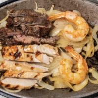 Mixed Fajitas & Shrimp · Two Sautéed Jumbo Shrimp With Beef & Chicken Fajitas, Served With Guacamole, Pico De Gallo, ...