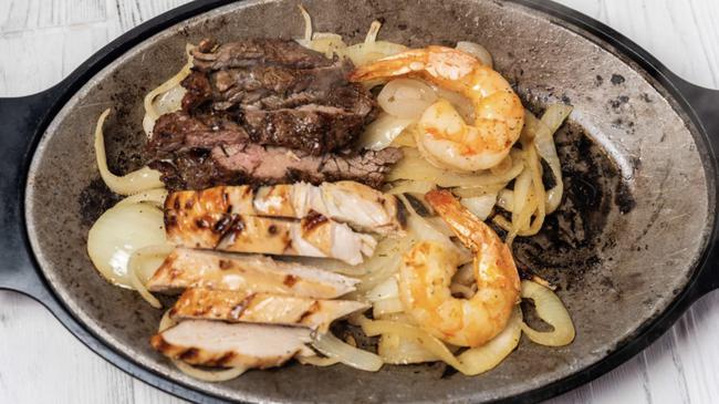 Mixed Fajitas & Shrimp · Two Sautéed Jumbo Shrimp With Beef & Chicken Fajitas, Served With Guacamole, Pico De Gallo, Sour Cream, Rice & Refried Beans
