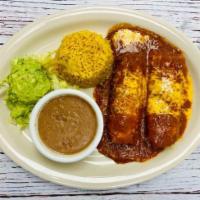 Tamales Compuestos · Two Hot, Plump Tender Pork Home-Made Tamales Topped With Melted Cheddar Cheese And Beef Grav...