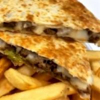 Steak Quesadilla · Served with sour cream, cheese and fries
