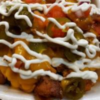 Loaded Nacho Cheese Fries · Served with your choice of meat, lettuce, tomato, onions, nacho cheese, and sour cream.