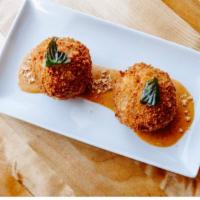 S1. Thairancini Rice Balls · Rice ball filled with slow cooked massaman beef and mozzarella cheese.