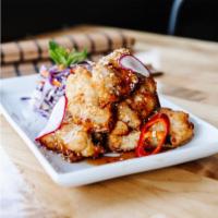 S14. Dynamite · Deep fried chicken wings with hot spicy sauce (Thai Style).