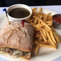 French Dip au Jus · Thinly sliced roasted prime rib, Swiss gruyere and fries.