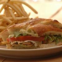 Grilled Basil Chicken Sandwich · Mozzarella, tomato, baby arugula, basil mayo, herb focaccia, and fries.