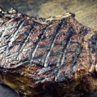 20 oz Bone In Cowboy Steak · Grilled prime aged steak.