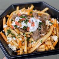 Gyro over  Fries  · Halal. Crispy fries topped with gyro meat and our homemade sauces.