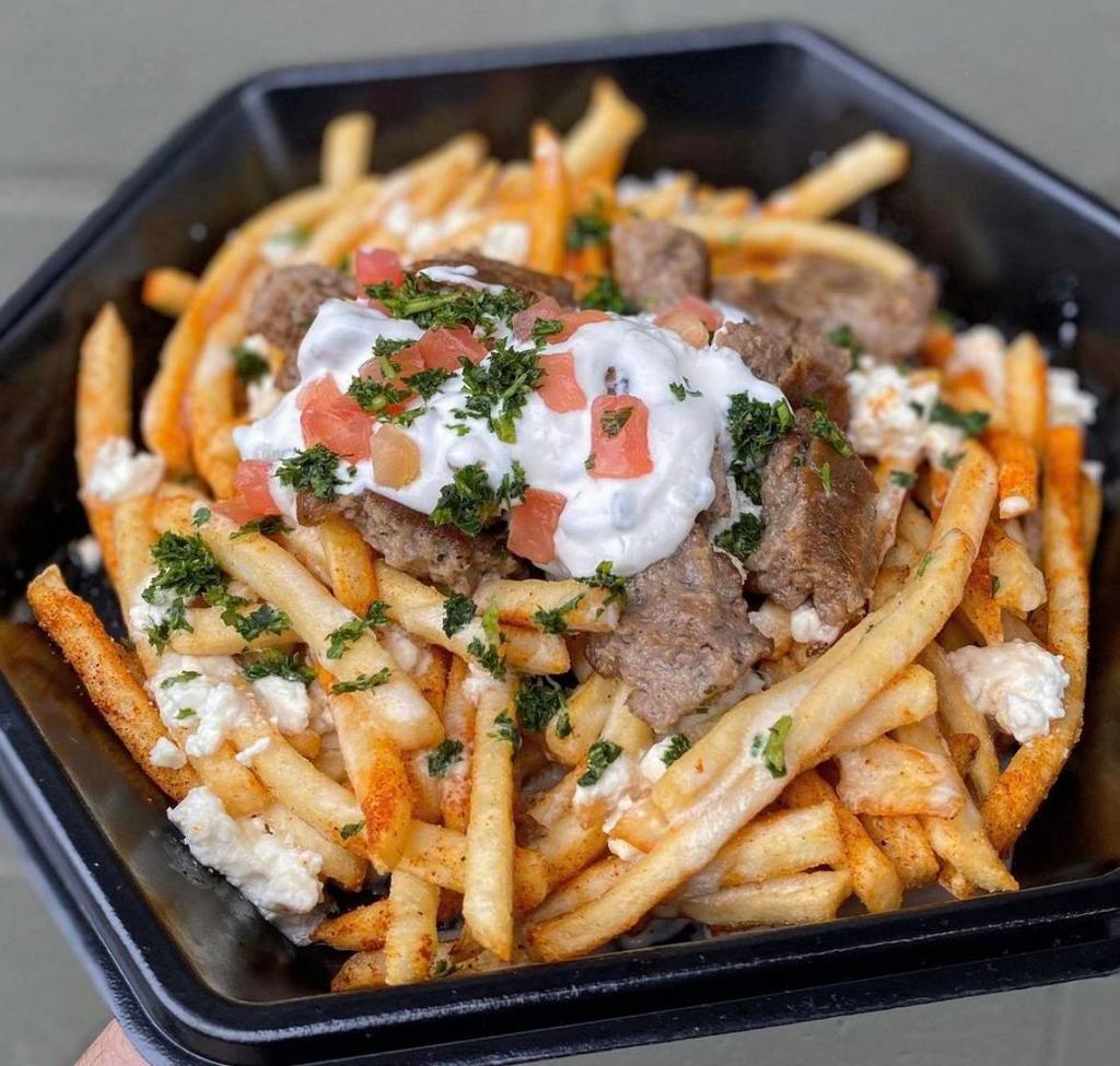 Gyro over  Fries  · Halal. Crispy fries topped with gyro meat and our homemade sauces.