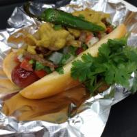 The Serrano Hot Dog · Sausage link with pico de gallo, grilled onions, our homemade Serrano sauce and a bag of chi...