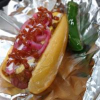 El Dandan Hot Dog · Sausage link, chili, melted cheese, pickled red onion, crema, Sriracha, hot sauce and a bag ...