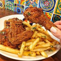 Hot Chicken Especialidade · Buttermilk fried chicken with a cayenne pepper paste. Served with garlic mojito fries.