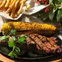 Cowboy Shell Steak Especialidade · Grilled and served with spicy ranch fries and grilled corn on the cob. 