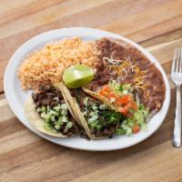 Taco Plate · Served with rice and refried beans, Includes 2 soft tacos choice of meat garnish with onions...