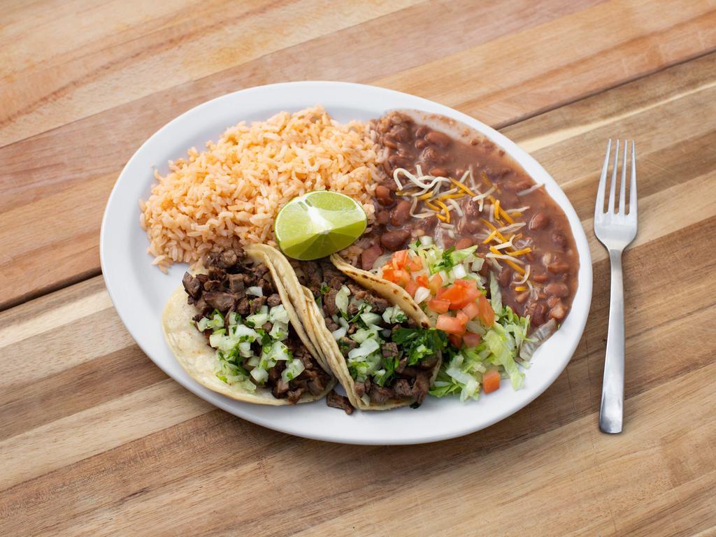 Taco Plate · Served with rice and refried beans, Includes 2 soft tacos choice of meat garnish with onions, cilantro, lime.