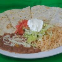 Quesadilla · Meat of choice and mozzarella cheese garnished with lettuce, sour cream and tomatoes.
