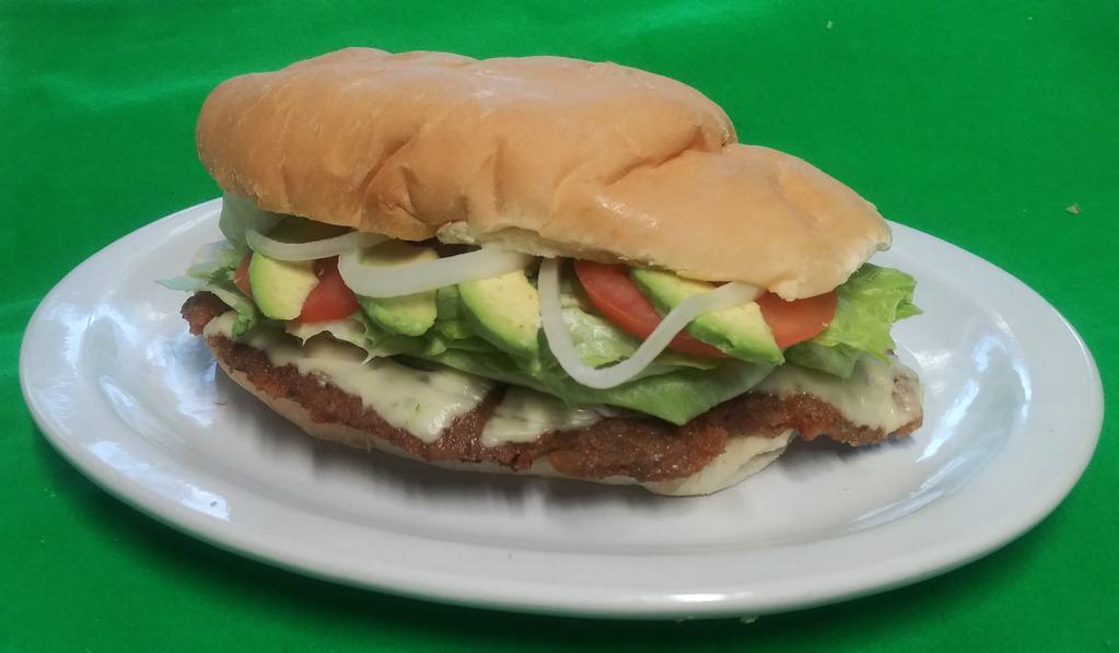 Milaneza Torta · Breaded beef. Includes beans spread, mayonnaise cheddar, lettuce, onions and tomatoes and melted mozzarella cheese.