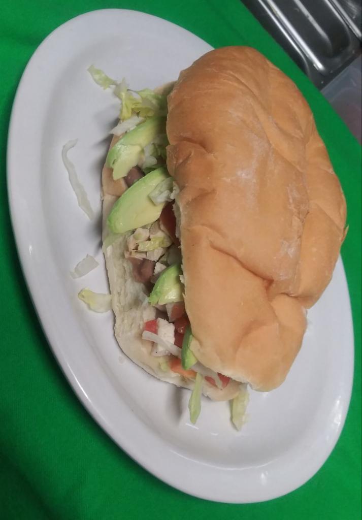 Torta Meat of your Choice · Includes beans spread, mayonnaise, mozzarella cheese, lettuce, onions and tomatoes and avocados sliced.