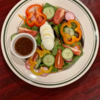 The One Salad · Baby spring mix salad, chopped romaine, radish, egg, bell peppers, tomato.