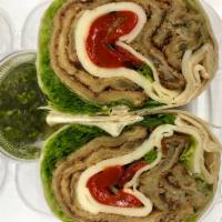 59. THE EGGPLANT WRAP · Breaded Eggplant, Provolone Cheese, Roasted Peppers, Romaine Lettuce & Pesto Spread on the s...