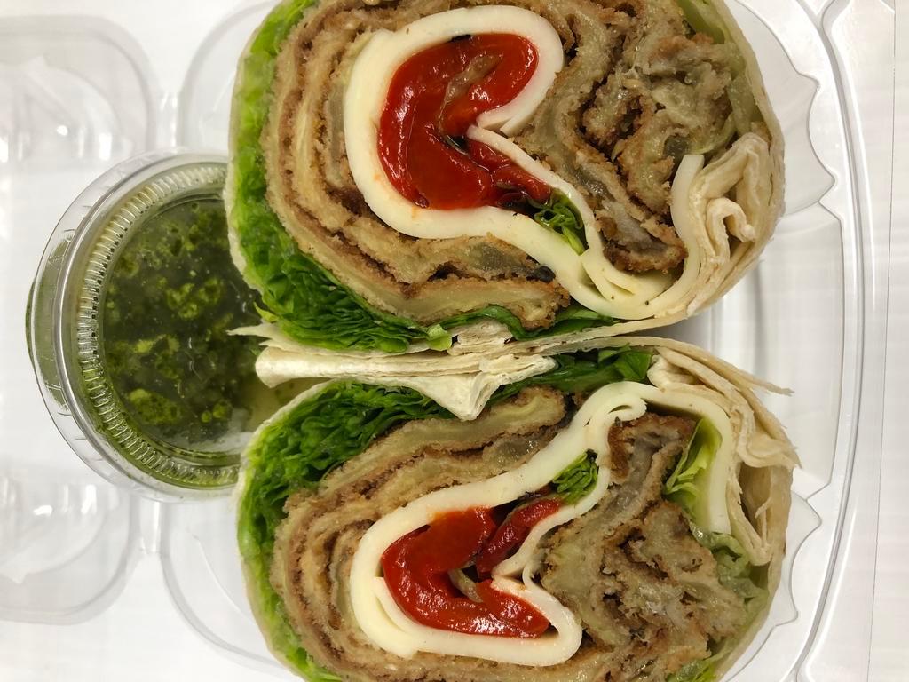 59. THE EGGPLANT WRAP · Breaded Eggplant, Provolone Cheese, Roasted Peppers, Romaine Lettuce & Pesto Spread on the side.