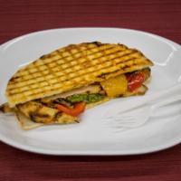 91. Grilled Chicken Panini · Served with broccoli rabe and peppadew peppers.