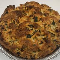 Zucchini Pie · Zucchini baked with fresh mint, cheddar and parmigiana cheese.