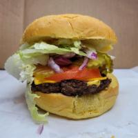 Big Tex Burger · Mayo, Mustard, Lettuce, Tomatoes, Onions, Pickles.