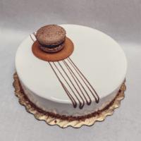 Vanilla Hazelnut Cake · A delicate vanilla sponge, a delicious vanilla mousse, cream with chocolate and whole hazeln...