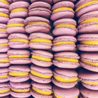 Passion Fruit Macaron · Two Macaron Shells gently filled with a Passionfruit ganache.