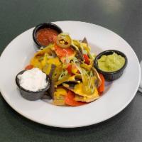 Nachos · Warm corn tortilla chips topped with cheese sauce, green scallions and jalapenos served with...