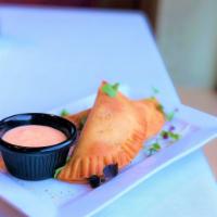 Chicken & Cheese Empanadas · Golden crispy dough filled with cheddar cheese blend & chicken served with Marie rose sauce