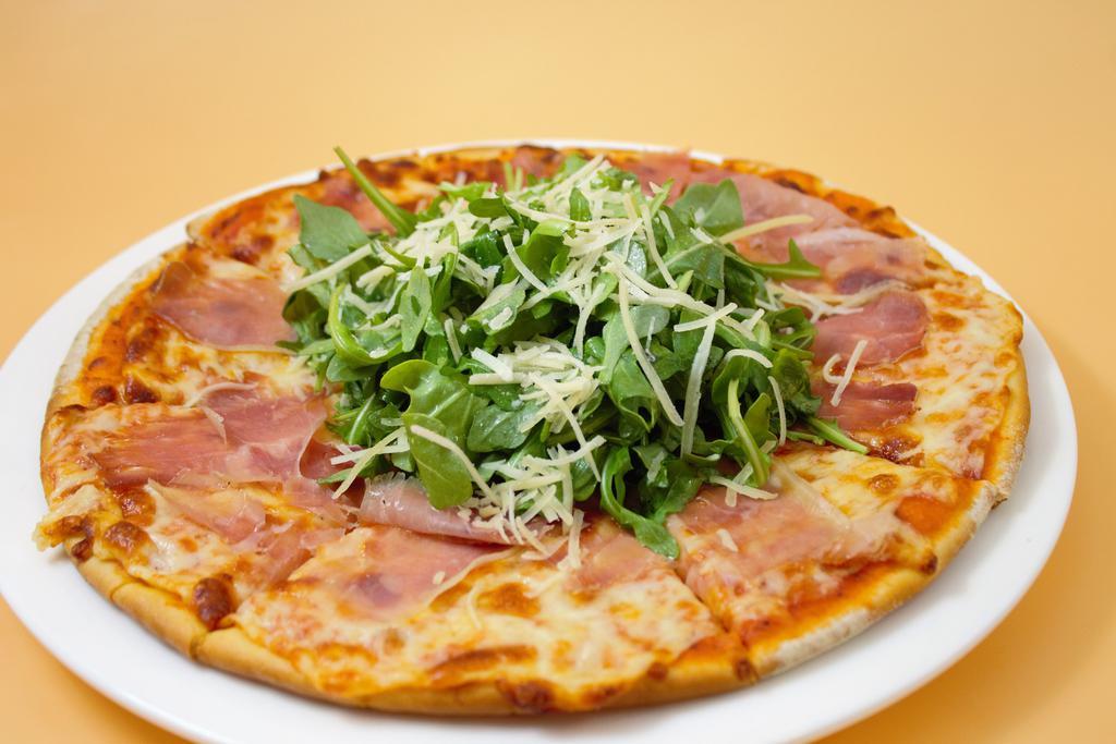 Prosciutto and Arugula Pizza · Marinara, mozzarella, prosciutto, arugula and Parmesan.