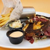 Reuben Sandwich · Corn beef, Swiss and sauerkraut on marble rye served with coleslaw and Russian dressing.