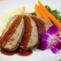 Grandma's Meatloaf · House seasoned ground beef with bacon and BBQ sauce served with mashed potatoes, sauteed car...