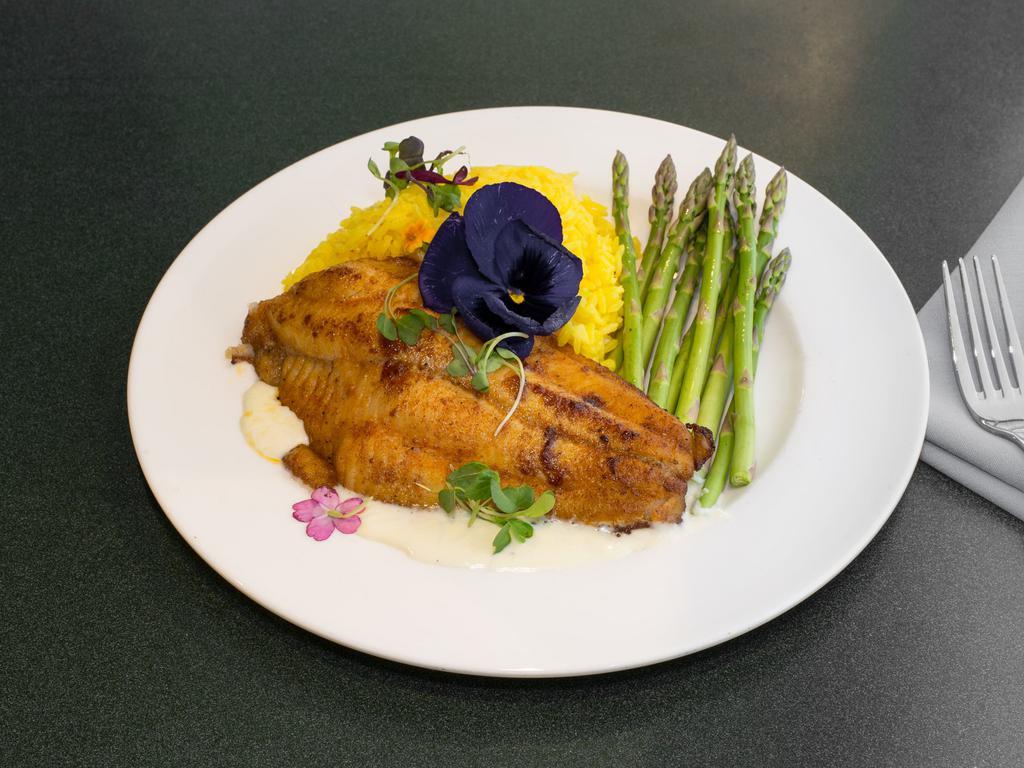 Sweet and Spicy Catfish · Filet of catfish seared with blackening spice and brown sugar, served with yellow rice, sauteed asparagus and a creamy shallot sauce.