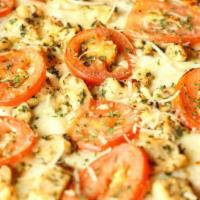 The Classic Pizza · Roasted chicken, Roma tomatoes, fresh basil, crushed garlic, mozzarella, and extra virgin ol...