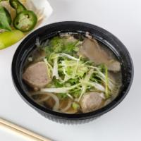 Pho · Rice noodle, broth, scallion, sliced onion, cilantro, served with jalapeno, Asian basil and ...