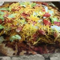 Taco Pizza · Beef, onions, shredded lettuce, mozzarella cheese and taco sauce.