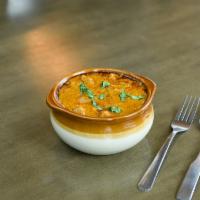 Butter Chicken · Chicken curry cooked in a butter cream base sauce.