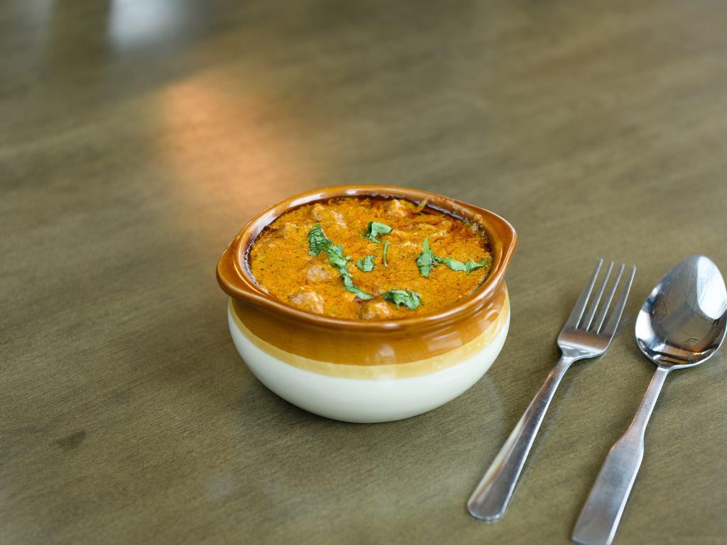 Butter Chicken · Chicken curry cooked in a butter cream base sauce.
