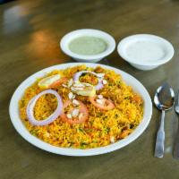 Chicken Biryani · A spiced rice layered with chicken, herbs, and spices.