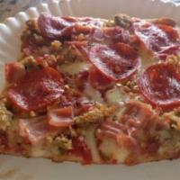 Meat Lover Pizza · Sauce, mozzarella, pepperoni, sausage, ham, bacon.