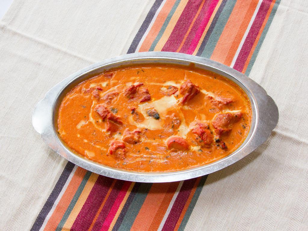 Chicken Tikka Masala · Chicken pieces roasted in a clay oven tossed in a creamy tomato sauce.