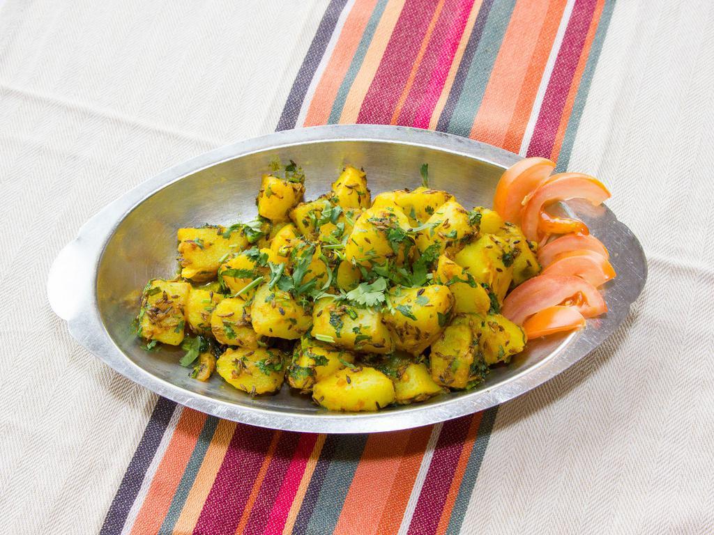 Aloo Jeera · Diced potatoes marinated with Indian spices and herbs finished with cumin.