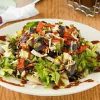 BBQ Chicken Salad · Fresh greens topped with diced chicken, tortilla strips, corn, black beans, onions, cilantro...