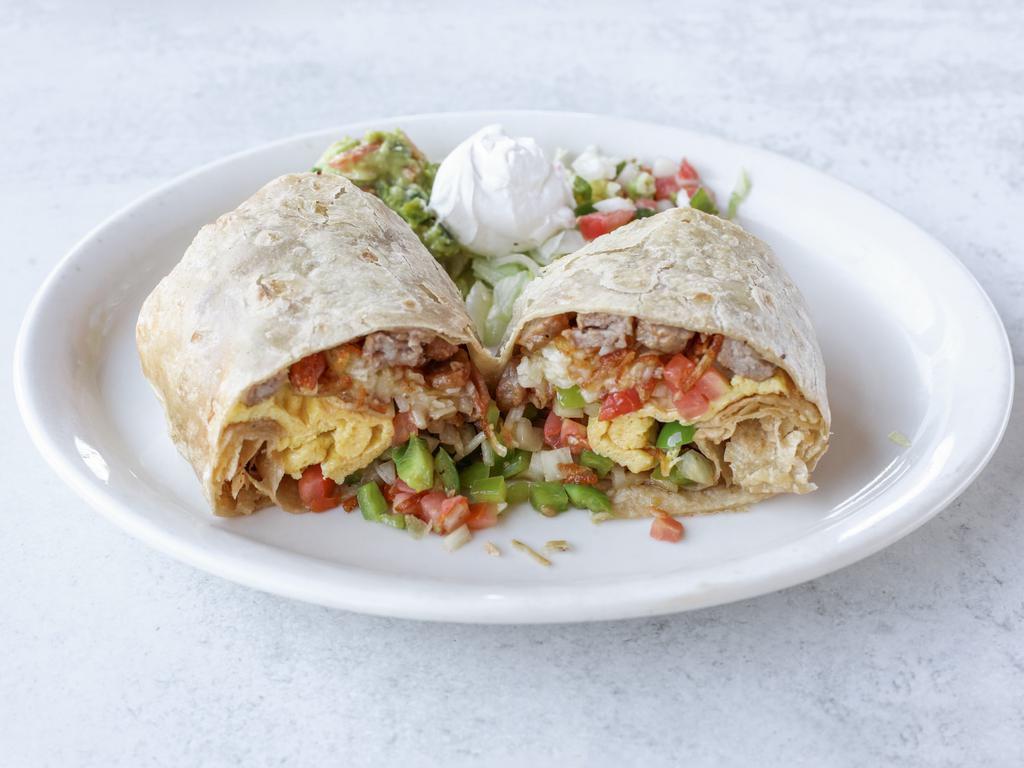 California Burrito · Large flour tortilla filled with fries, steak, guacamole, sour cream and cream. Filled with rice, beans, sour cream, cheese, onion, and cilantro.