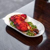 Tandoori Chicken · Two pieses of chicken leg marinated with yogurt, ginger, garlic and mild spices. Comes with ...