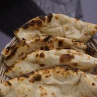 Plain Naan · Indian style bread baked in the tandoor.