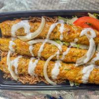 Kofta over Rice  · Comes with Aromatic Basmati Rice, Chicken kofta, Grilled Onion, Green pepper, Cilantro, Sala...